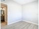 Simple bedroom with gray walls, wood flooring and access to bathroom at 101 Gerry Dr, Altamonte Springs, FL 32714