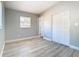 Bright bedroom with gray walls, wood flooring, and a window at 101 Gerry Dr, Altamonte Springs, FL 32714