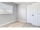 Spacious bedroom with gray walls, wood flooring, and large closet at 101 Gerry Dr, Altamonte Springs, FL 32714