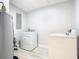 Laundry room with washer, dryer, and updated flooring at 101 Gerry Dr, Altamonte Springs, FL 32714