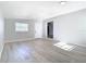 Bright living room featuring light gray walls and modern wood-look flooring at 101 Gerry Dr, Altamonte Springs, FL 32714