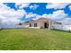 Large backyard with grassy area and home view at 1721 Sunfish St, Saint Cloud, FL 34771