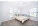 Bright bedroom with a queen bed and neutral decor at 1721 Sunfish St, St Cloud, FL 34771
