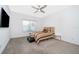 Bedroom with striped bedding and a wall mounted TV at 1721 Sunfish St, St Cloud, FL 34771