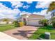 One-story house with a brick paved driveway and landscaping at 1721 Sunfish St, St Cloud, FL 34771