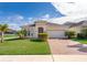 One-story house with a brick paved driveway and landscaping at 1721 Sunfish St, St Cloud, FL 34771
