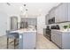 Bright kitchen with gray cabinets and a large island at 1721 Sunfish St, St Cloud, FL 34771