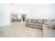 Open living room with a view of the kitchen and a sectional sofa at 1721 Sunfish St, St Cloud, FL 34771