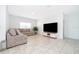 Comfortable living room with sectional sofa and large TV at 1721 Sunfish St, St Cloud, FL 34771