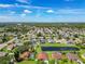 Aerial view of community with houses and a pond at 1918 Crosshair Cir, Orlando, FL 32837