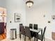 Bright dining area with black chairs and modern glass top table at 1918 Crosshair Cir, Orlando, FL 32837