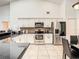 Modern kitchen with stainless steel appliances and white cabinets at 1918 Crosshair Cir, Orlando, FL 32837