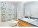 Clean bathroom with shower/tub combo and wood vanity at 1960 Jan Lan Blvd, St Cloud, FL 34772