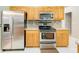 Stainless steel appliances and oak cabinets in this kitchen at 1960 Jan Lan Blvd, St Cloud, FL 34772