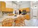 Kitchen boasts oak cabinets, stainless steel appliances, and an island at 1960 Jan Lan Blvd, St Cloud, FL 34772