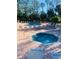 Community pool and spa with lounge chairs at 2033 Royal Bay Blvd # 49, Kissimmee, FL 34746