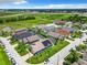 Aerial view of community with houses and pools at 204 Fox Loop, Davenport, FL 33837