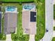 Aerial view of house with solar panels and pool at 204 Fox Loop, Davenport, FL 33837