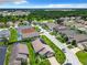 Aerial view of neighborhood with solar-paneled homes at 204 Fox Loop, Davenport, FL 33837