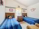 Bedroom with twin beds and shared bathroom at 204 Fox Loop, Davenport, FL 33837