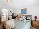 Main bedroom with king bed, en-suite bathroom access, and sitting area at 204 Fox Loop, Davenport, FL 33837