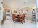 Bright dining room features a large table, hutch, and elegant chandelier at 204 Fox Loop, Davenport, FL 33837