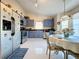 Bright kitchen with stainless steel appliances and ample cabinet space at 204 Fox Loop, Davenport, FL 33837
