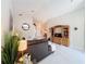 Living room features a cozy sectional sofa and built-in shelving at 204 Fox Loop, Davenport, FL 33837