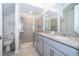 Main bathroom with double vanity and walk-in shower at 2166 Fleming Mist Pl, Kissimmee, FL 34747