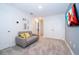 Spacious bonus room with comfortable couch and large closet at 2166 Fleming Mist Pl, Kissimmee, FL 34747