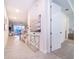 Bright entryway with glass-top console table and view into living area at 2166 Fleming Mist Pl, Kissimmee, FL 34747