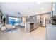 Modern kitchen with gray cabinets, stainless steel appliances, and island at 2166 Fleming Mist Pl, Kissimmee, FL 34747