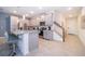 Modern kitchen with gray cabinets, stainless steel appliances, and an island with seating at 2166 Fleming Mist Pl, Kissimmee, FL 34747