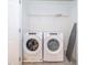Laundry room with side-by-side Whirlpool washer and dryer at 2166 Fleming Mist Pl, Kissimmee, FL 34747