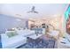 Open living area with white sectional sofa, and kitchen view at 2166 Fleming Mist Pl, Kissimmee, FL 34747