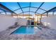 Private screened-in pool with lounge chairs and brick pavers at 2166 Fleming Mist Pl, Kissimmee, FL 34747