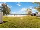 Large backyard with pond and lush green grass at 2482 Yellow Brick Rd, St Cloud, FL 34772