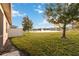 Spacious backyard with pond view and screened patio at 2482 Yellow Brick Rd, St Cloud, FL 34772