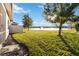 Spacious backyard with pond view and screened patio at 2482 Yellow Brick Rd, St Cloud, FL 34772