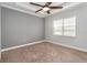 Well-lit bedroom with neutral walls and ceiling fan at 2482 Yellow Brick Rd, St Cloud, FL 34772