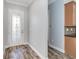 Light gray entryway with wood-look tile flooring at 2482 Yellow Brick Rd, St Cloud, FL 34772
