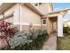 Home exterior with tan siding and a landscaped walkway to the entry at 2482 Yellow Brick Rd, St Cloud, FL 34772