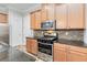 Modern kitchen with stainless steel appliances and granite countertops at 2482 Yellow Brick Rd, St Cloud, FL 34772
