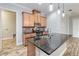 Modern kitchen with island, stainless steel appliances, and granite countertops at 2482 Yellow Brick Rd, St Cloud, FL 34772