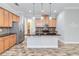 Modern kitchen features stainless steel appliances and granite countertops at 2482 Yellow Brick Rd, St Cloud, FL 34772