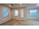 Bright entryway with neutral carpeting and tile at 254 Bella Prestwick Blvd, Davenport, FL 33837