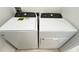 White Whirlpool washer and dryer set in a laundry room at 254 Bella Prestwick Blvd, Davenport, FL 33837