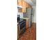 Kitchen with stainless steel appliances and wood cabinets at 2602 Lemon Tree Ln # H, Orlando, FL 32839