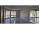 Spacious living room with tile floors and large windows at 2602 Lemon Tree Ln # H, Orlando, FL 32839