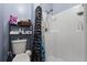 Bathroom with shower stall and toilet at 2620 Hunley Loop, Kissimmee, FL 34743